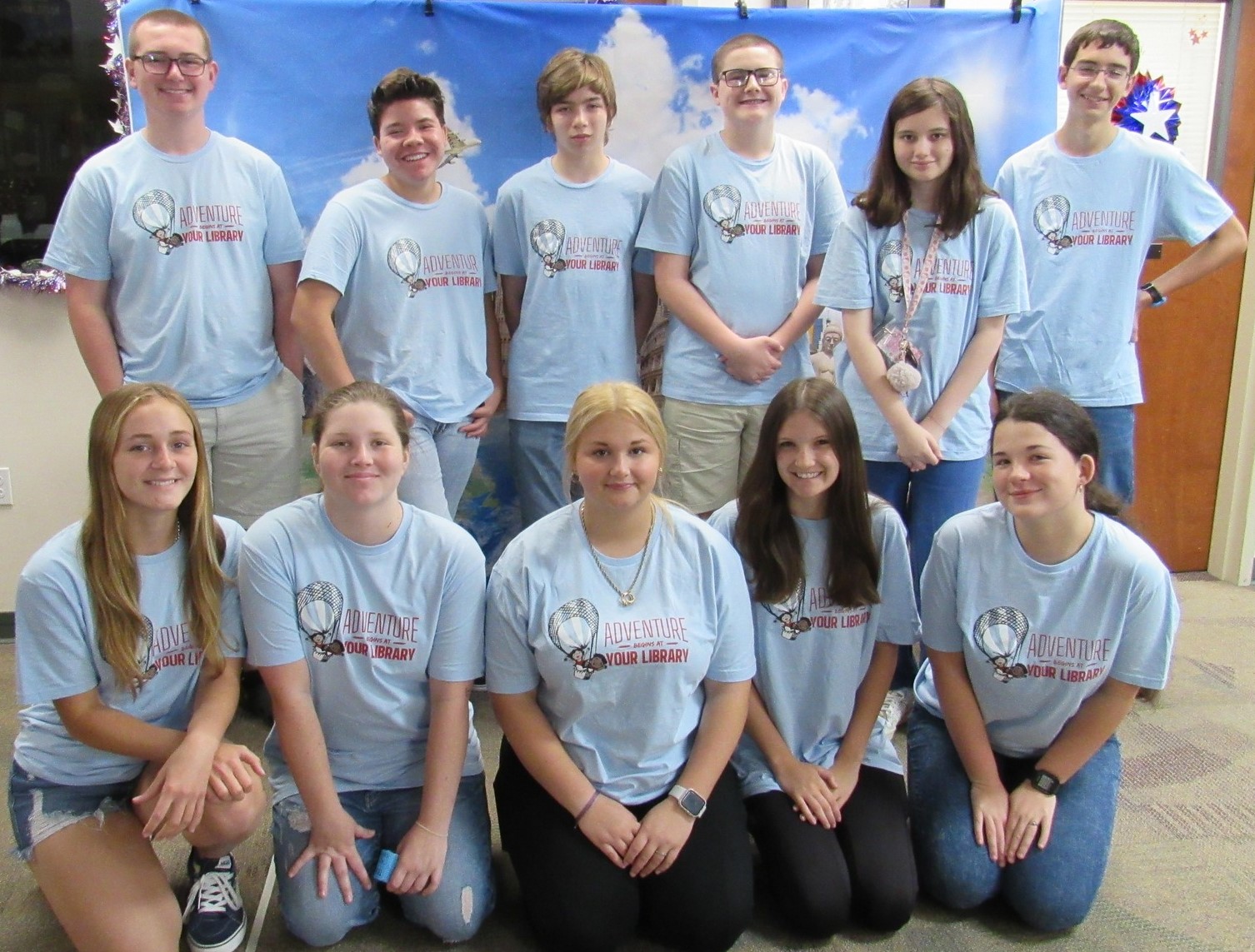 Group of teens wearing summer reading tshirts